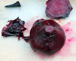 Rub the beet skins with your fingertips.