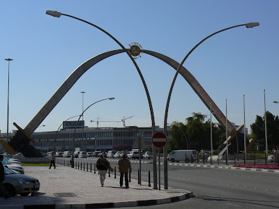 Two giant swords touch to form an arc over Grand Hamad Street.