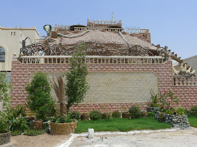 A Qatar Villa - with a dinosaur on top of it!