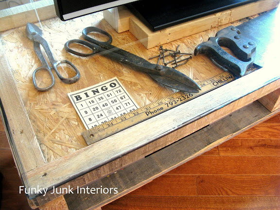 How to build a free rustic TV stand out of a pallet, with vintage crates for storage! Click to read full tutorial.
