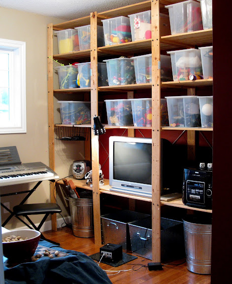 Toy storage in floor to ceiling Ikea bins and Gorm shelving in a kid's playroom | funkyjunkinteriors.net