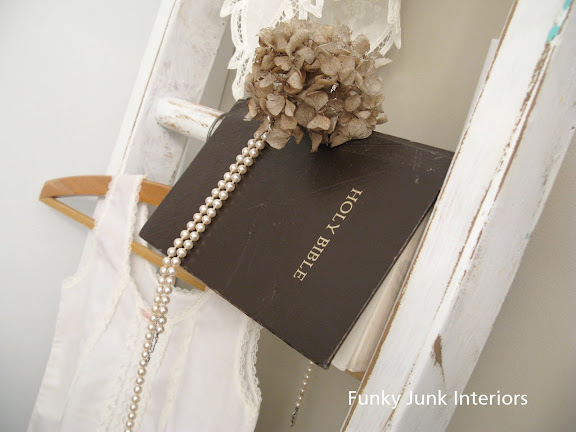 ladder display / A salvaged White Trash bedroom makeover with old door and gate headboard, via FunkyJunkInteriors.net