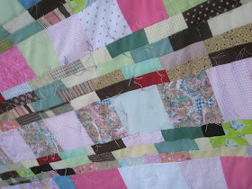 Humanitarian scrappy strip quilt twin size with sheet for backing