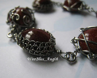 wire wrapped bracelet wire wrapped bracelet with netted bezel cab (goldstone)