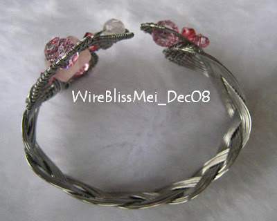 Side view of the Braided Cuff (Facing the Cobra II) with Rose Quartz focal and Swarovski crystals