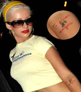 images of christina aguilera lower back tattoo