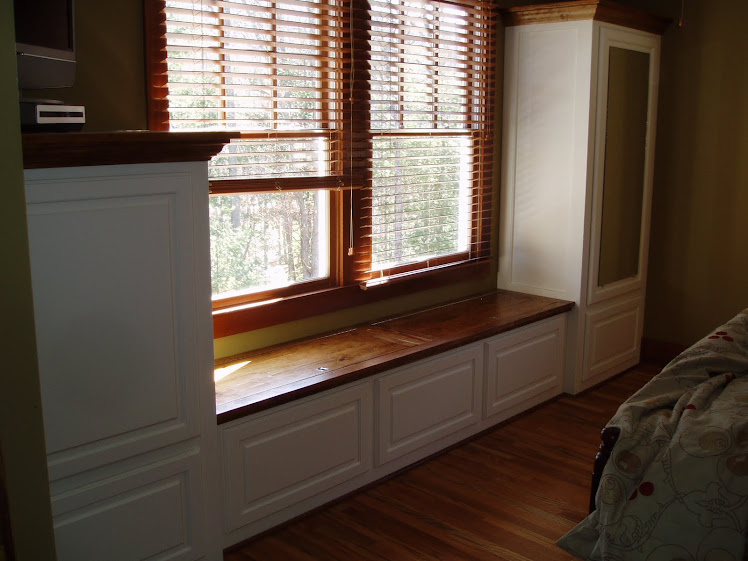 Master bedroom built-ins with storage bench