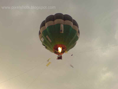 image of hot air balloon flying in the sky from calicut kerala