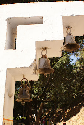 Bells hanging outside the entrance to the Bada Mahadev complex in Pachmarhi