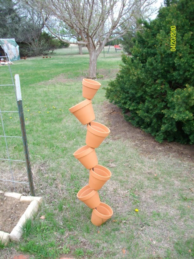 Doing my best for Him Leaning plant pot tower with bigger pots