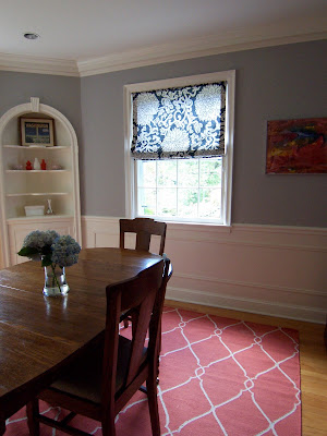 gray dining room with wooden table