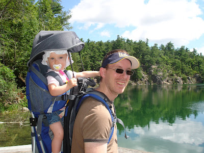 Man and child Image of a man with a baby on his back