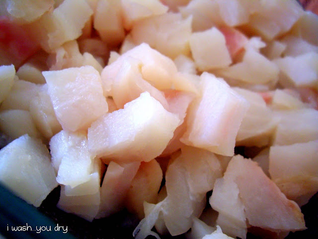 A close up of chopped raw fish. 
