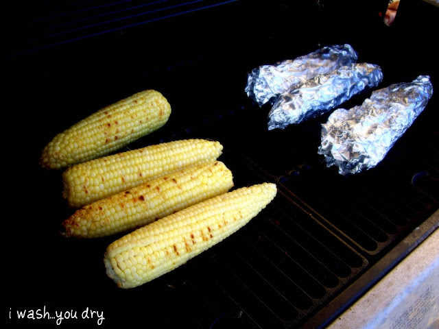 Cobs of corn on a grill.