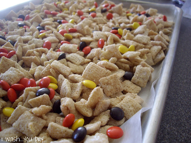 Close up of cereal and Reeses Pieces on a baking pan