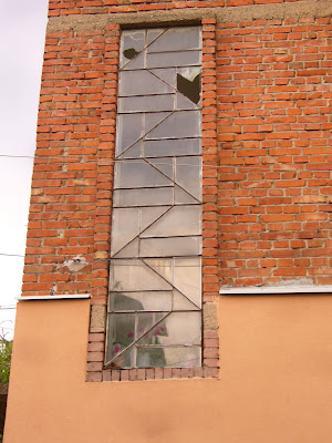 A Long Vertical Glass Framed Window In Yambol City Centre