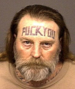 FUCK YOU forehead tattoo
