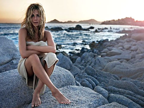 Jennifer Aniston appears almost naked on beach for perfume ad