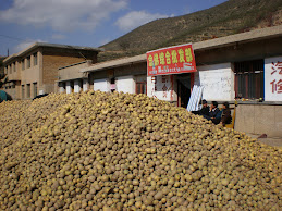 Mountains of potatoes for sale