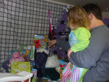 Daddy showing Brooke what Santa brought!