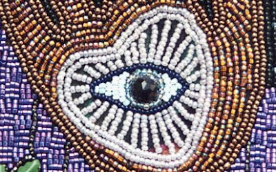 bead embroidery by Robin Atkins, detail of bag showing eye and heart