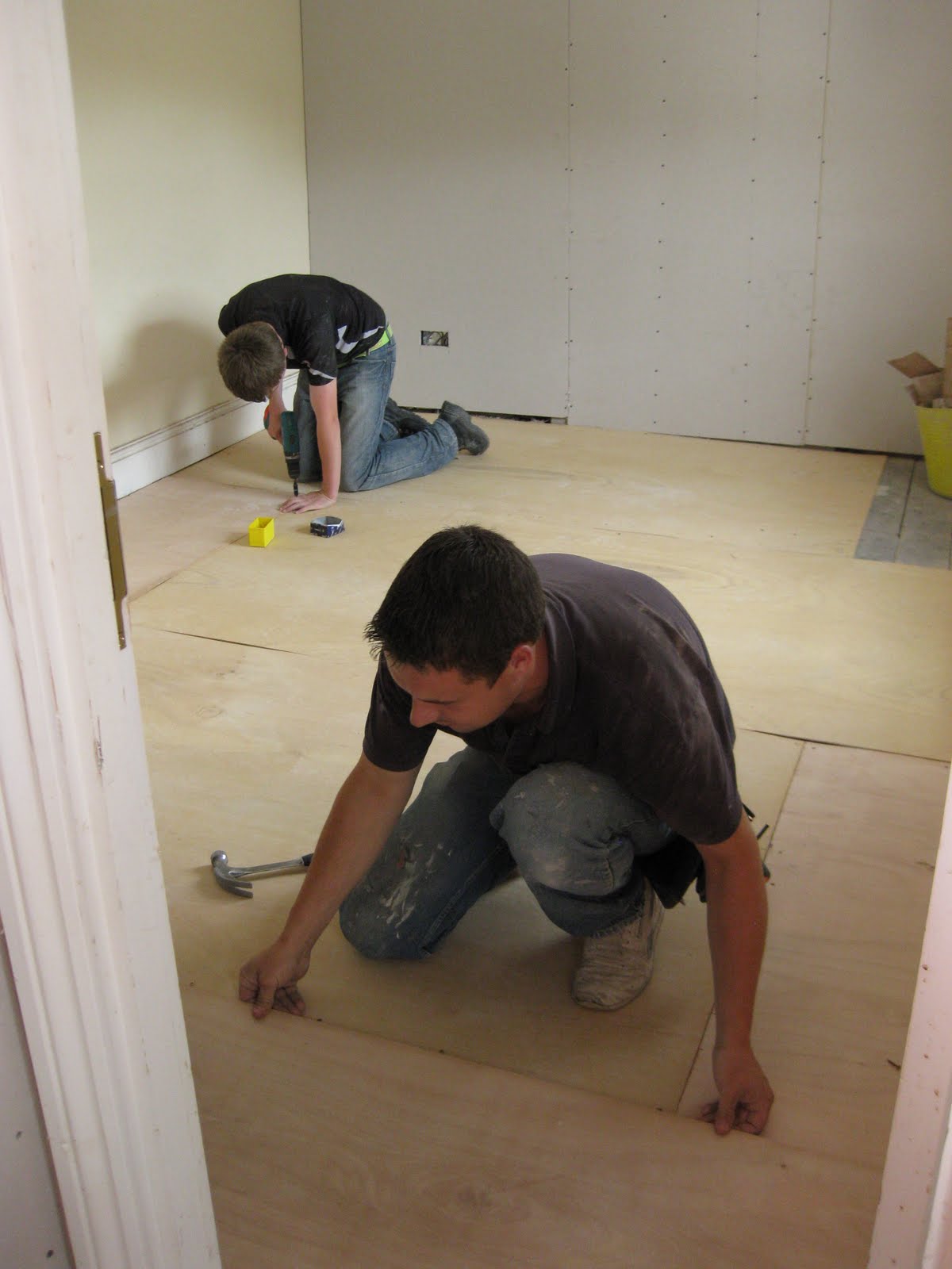 Bodlondeb is born again Carpenters laying plywood over the most uneven