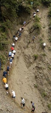 2006: The men's field of Tuesday's Mount Marathon race heads up the rocks at the base of the mountain.