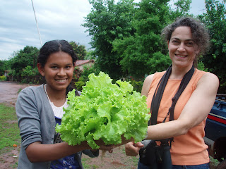 Image of two women holding lettuce 