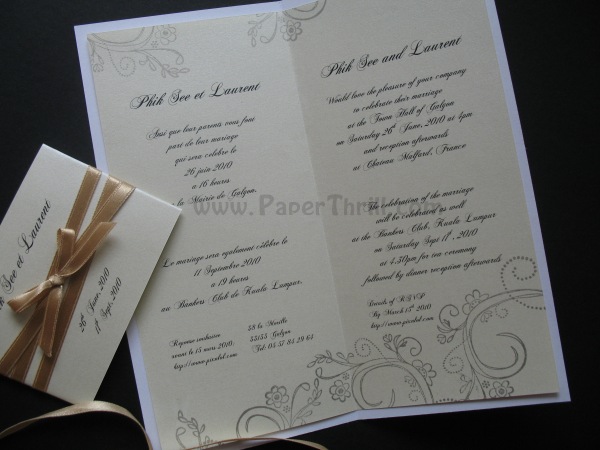This handmade wedding invitation is a variation from the Vintage Swirls 