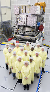 The GOES-P instrument team is pictured here in the Boeing facility with the GOES-P satellite after completion of the instrument testing