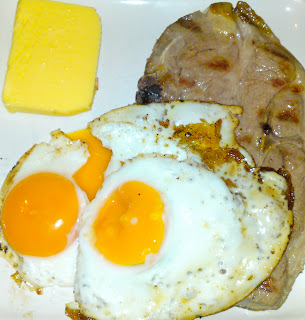 Grilled lamb forequarter chop and fried egg, with butter