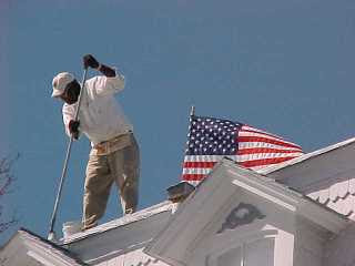 Mr. Mobley applying final coat on Inn of Cape May