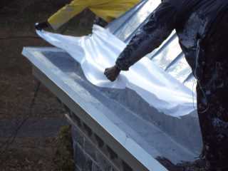 Repairing gutter during winter on standing seam metal roof