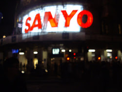 "Piccadilly Circus" junction with "Ceon hoardings" akin to "Chungking mansion" in Hongkong..