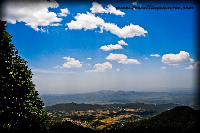Travelling-Camera sharing some high altitude captures from Road Journey to Bir-Billing: World Famous place for Paragliding: Posted by VJ on www.travellingcamera.com : VJ capturing reflection of beautiful Billing on car-window... Travelling Camera @ Billing, World's famous Para-gliding site...After a long road journey through Mandi, Hamirpur, Sujanpur-Tira, Palampur, Dharmshala and Baijnath, we finally reached Billing, world famous site for Paragliding.Just crossed Bir to reach Billing for experiencing paragliding on world's famous site in Dhauladhar Mountain range... Under legs of mountains and surrounded by tea gardens Bir a small village with a Tibetan Colony and monasteries in Kangra district of Himachal Pradesh(INDIA) which serves as a landing ground and a base for Hang/Para-gliders. Launching or take-off place is BILLING which is a little meadow at 2408 meters (8550 feets) on the Dhauladhar ranges: 14 kilometers up from Bir. This meadow is one of the wonders of nature seems like perfectly designed as a launch pad. Billing has become a legend on the international paragliding circuits and a destination for World Champion Paraglider pilots. The meadow directly above the villages of Bir and Chaugan is one of the best gliding sites in the world...Travelling Camera trying to capture wonderful colors of BILLING through side mirror of Hundai i10 ... From Billing the mountain range runs all the way to Dharamsala by separating the Kangra district distrc from Chamba. To the north of the meadow is the high peaks and to the south the plains. The fall from the meadow is about one kilometre and an average straight top to bottom flight to the Chaughan landing area lasts for about 30-45 minutes.A View of Jogindernagar region from a small road towards BILLING from Aehju...Road between Aehju and Bir is fine but the stretch of 10 kilometers was in very bad conditions. Its a very narrow road and rough at most places... Careful driving is very important because there are deep valleys on the other edge of this road... Initially its discouraging but after reaching BILLING, we found it worth it... A View of landing place BIR from the most famous paragliding destination in Dhauladhar range... The huge Dhauladar mountain range and Kangra valley with its panoramic views offer opportunities for high altitude flying for more than 190 kilometers. The Dhauladar range runs from Dalhousie in the North West of Himachal Pradesh in a curving arc of south-east to Mandi. Billing lies roughly midway between Dharamsala and Mandi and to the south west of Manali/Kullu valley.Tourist Vehicles @ BILLING, amazing para-gliding site in INDIA.. Billing is very well known in world for having the distinction of organizing the very first Paragliding competition according to the rules of Federation Aeronautique International. The Department of Tourism of Himachal Pradesh also organizes 'Para Gliding Pre world Cup' at Billing- Bir . It is also the place for Hang gliding and Para Sailing...Travelling Camera capturing the only house at high altitude of Billing Hills in Dhauladhar Range...