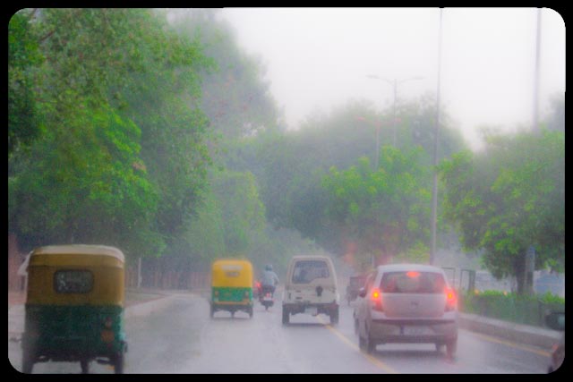Monsoons in Capital of INDIA ( DELHI ): Posted by VJ Sharma on www.travellingcamera.com : Now monsoon is there in Delhi and probability of traffic jams has increased in capital city of INDIA. Here are few photographs clicked during monsoon season of 2010...As per my definition, Monsoon is a much awaited season after scorching summers and people get bored of this season soon :-)I enjoy rains at times but these should not be continuous... Rains bring freshness in our surroundings but they can ruin many other things due to this continuous behavior... Two senior people struggling with heavy rains and fog of Delhi to reach office in morning @ 10:30 AM... A scene of dense fog near Lodhi estate near India Islamic Center...A scene of dense fog near Lodhi estate near India Islamic Center...Flyover work going on for Common Wealth games in INDIA this year (2010)