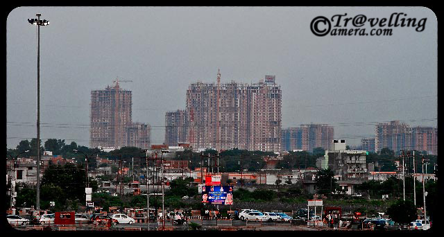 Lot of Real Estate Projects(Residential Appartments) in  Noida : Which one to choose? : Posted by VJ SHARMA on www.travellingcamera.com :This year in 2010, every month many real estate builders are announcing new Projects in Noida... Mainly in Sector 119, 121, 74, 75, 76, 77, 78, 137, 110, 100, 162 etc .... For last four months I have been seraching for a good option for me but after talking to lot dealers decision becomes more difficult... During my visists to all these places, I had clicked some photographs of new projects in Noida.. Here are some of the photographs of Real Estate Projects in Noida....This is a view of Sector-50 which is very well developed today and there are some projects still progressing on one side of it... This is a view of Oxame Twin Towers, Mahagun's new project in sector-50 and some other projects on the back side... Mostof them will be ready for posession by end of 2011... but no one can assure...Apart from core noida, there are many projects going on in Noida extention which is Greater-noida... and beyond Pari chowk....Here is a view of some of the projects in secto-50 which have already been dilivered to buyers... There are some very good aparatments in Sector-50 but some of them have very bad location...Noida Extension also has lot of projects at comparitively cheaper rates... I am not sure how the booking are going there but rates are appreciating like anything which is not a very good sign in my opinion... When I went to Noida extension, it looked like a fair going on there.. there were lot of stalls and people shouting to bring more customers to their stalls for various projects in Noida Extension area...If you have a set priority for floor and location, decide a particular flat in a partciular tower and go to different dealers with same choice.. Do it for one week and you will find that its available but when you catch any dealer first time, he will say 
