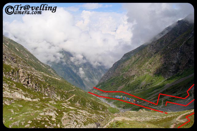 Typical Trekking routes on the way to Manimahesh Yatra in Himlayas (Pir Panjal Mountain ranges) : Part-1 : Posted by VJ Sharma @ www.travellingcamera.com : For last few day I have been sharing some of the photographs clicked during my Trekking experiences to Manimahesh in Chamba Distrcit of Himachal Pradesh... Today I thought of sharing some photographs of this trek and how these treks crwal on Himalayan Hills...So here are some pf the photographs showing typical trekking routes to Manimahesh...Its a wonderful trekking opportunity on Pir Pajal hills of Himalayas... As you can see in these photographs, these tracks look very small against the huge hills... and these are just the tips of the whole mountain range which is difficult to capture in one shot... Notice the small track on right bottom of this photograph and shaodws due to hill top... I am sure you would be able to imagine the height of this hill against sky and feel the mment when someone is moving on this trek... If you able to do so, expect some clouds coming on your way in few seconds :-)Here is same photograph with some marks around the main trekking path to Manimahesh... If you had some difficulties understanding the first photograph, now it should be easy to enter the virtual world of himalyan Treks :-)If you are able to imagine yourself on this route, I am sure you would be able to relate to this photograph... Now we have reached a height after different curved paths.... Here is a view of a valley with some plain area which is being used for taking rest in the rested tents there... First photograph was clicked between this point and the tent-area we are seeing here....Again some marks to help you better understand the route... route starts from left most mark.. breaks at right-top end of this photograph... and after a hidden route (covered in first photograph...) , path again move towards the left...Hold on... See this photograph and imagine yourself standing somewhere on this path... can you guess how long in this stretch? It would be nice to hear back from your about it through comments in this post... It was a very long trek between two huge moutains... imagine that bottom of this hill looks like a plain valley and try to have a view of this hill in your mind.. Believe me, it was an amazing experience... and I fully enjoyed it...Here is same photograpg with some marks around trekking path between two huge hills on the way to manimahesh in Chamba District of Himachal Pradesh... With this I going to stop here and would share more trekking experiences through hills covered with snow and clouds....