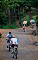 aFirst Day rides during MTB Himachal 2010 - A Road journey in Himalayas : Posted by VJ SHARMA on www.travellingcamera.com : Hope you have already checked flag-off and some glimpses of MTB Himachal 2010... If not, I would recommend you to check out following two links before checking these photographs of very first day...Here are few more photographs of first day of MTB Himachal 2010 - Shimla  Mashobara Shainj (Final Destination for the day)MTB Riders climbing a normal height on good roads on first day...The flagoff from Shimla Ridge was a great improvement over previous year's start from the Peterhoff hotel grounds - more accessible to the general public and the first day's stages were a bit of a warm up... All the riders started from Ridge and moved towards Mashobara.. A few kilometers from Mashobara, first stretch for racing had to start... All set and it started in batches for 8-12 riders...Some of the MTB riders were very fast and they always lead the whole group... A Group from Nepal and another was Indian Army group... They had best cycles as compared to other folks..One of the rider coming towards the bike after taking rest.. It was raining, so some of us stopped riding and rested till it stopped... Notice the road conditions and imagine how they would have been after rains...As far as I remember, there were only two girls who were riding.. One was indian and other was from Nepal... Here is Number 57, Indian Rider who had great sense of humor :-)Another rider of the gang who faced lot of hurdles on the way... But he rode till the end...Every rider had a diary with him/her.. Before starting of any stretch, volunteers used to write down the time in those diaries and duration was calculated on ending of each stretch... Riders used to move in various groups and final timing had to be calculated on last day...Can you guess who are these?Here comes Mr.Rocky with his racing car... For now I am not explaining anything about it because I will have a separate post on this vehicle :-)It had been raining the day before and was still overcast ... After covering few kilometers, it started raining and since we were in Forests of Deodars, there was no place to hide from rains....Here comes Mr Suban Walia, who joined the gang mid-way... I think, he had just parked his Swift to take some photographs of riders on the way.... A true fan of NIKON We met many friends during this event and one of the Photographer called all the dogs with same name 