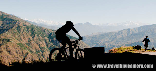 MTB Riders on highest speed in the downhill stretch parallel to snow covered mountain ranges (On Third day) : Posted by VJ SHARMA on www.travellingcamera.com : Hope you have been enjoying this PHOTO JOURNEY through various routes of MTB Himachal 2010... Its 10th post on this great Himalayan event for passionate bike Riders... on third day, I noticed the highest speed of all the riders in a downhill stretch in parallel to snow capped mountain ranges... Check out some of the photographs of this downhill stretch across snow covered hills...First I wanted to give you a feel of the road where we were waiting to catch fast riders of MTB Himachal 2010... Road was situated on a very high hill in parallel to these mountains covered with snow... wonderful place with nice weather and beautiful surroundings...Here comes a group of riders and Cameras are not set to estimate their speed and adjust accordingly... It took time to adjust our cameras to shoot exactly what we wanted to shoot... At least I tried various things with first few riders and was able to identify right place with right settings....They were moving like anything.... Amazing actions, styles n movements...Even folks on the road were moving downwards toward the deep valley to save themselves fom these fast moving riders :) btw he is another Photographer struggling to set himself for shooting this rider...Rider number 41 ... Most of the riders knew each other by their rider numbers and it was difficult to remember the names of everyone but was very easy to know each other by rider nunber because they were sepnding most of the time on the roads crossing each other...Another rider on full speed in the middle of beautiful himalayan mountains in the state of Himachal Pradesh.... Thanks to MTB Himachal 2010...Mr. Ranjan Mandyal playing in air during MTB Himachal 2010... I got a chance to meet some great folks who have passion about bke riding and do lot of other good things in their lives... Ranjan was one of the guy I met and got a chance to understand him better... Hope to meet all of them again :)Here is another MTb rider in style... moving towards the final goal which is near Satluj river near main highway..Amcha rider from Maharshtra Police... a nice photographer as well... He was planning to host an exhibition in Kolkata and also invited us... Hope to see him next year again...Somehow I wanted to share all these photographs in black and white but it would have been unfair to the colorful beauty of surrounding himlayan mountains....Loved this journey and the colors of himalayas...