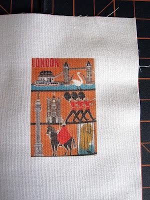 Piece of fabric with an image of a vintage tea towel printed on it.