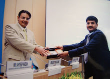 Suchit Dave being presented with Momentous at the CIB Seminar on "Judicial Reforms"