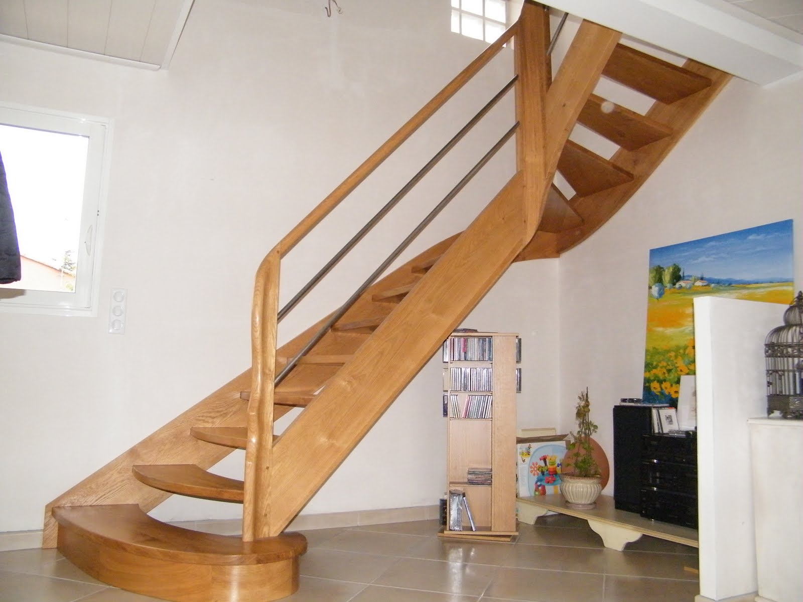 evolution-bois: escalier chêne départ noyau, barreaux inox