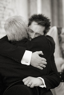 dad-hugs-groom family congratulates groom