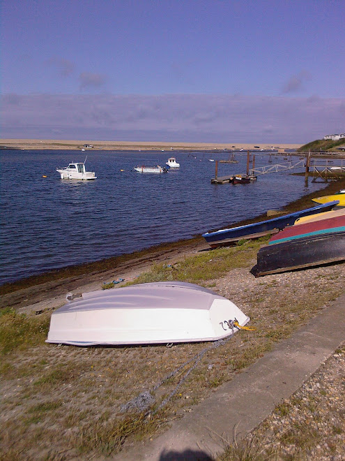 UPTURNED WHITE BOAT AT FERRYBRIDGE