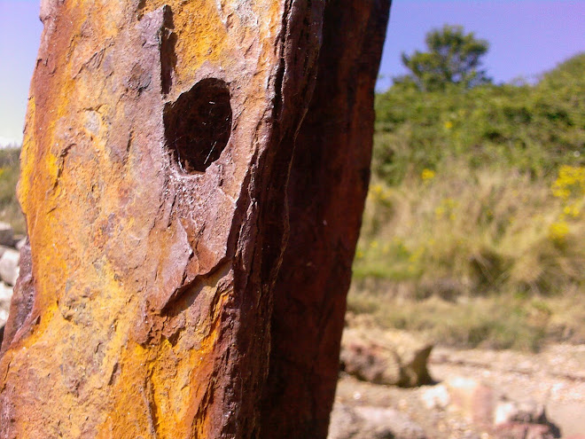 RUSTY METAL WITH HOLE