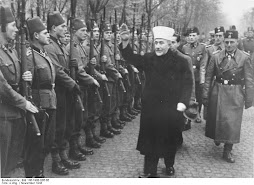 Arab Leader Al-Husseini greeting Nazi SS troops