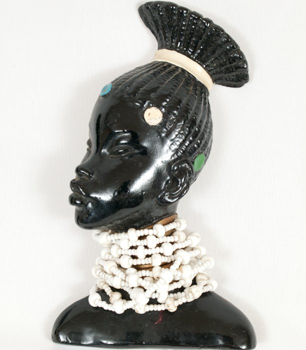 [1950s+kitsch+African+wall+sculptures+-+www.ShopCurious.com.jpg]