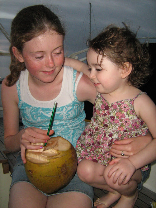 Rheannon and Jillian sharing a 'drinking' coconut.