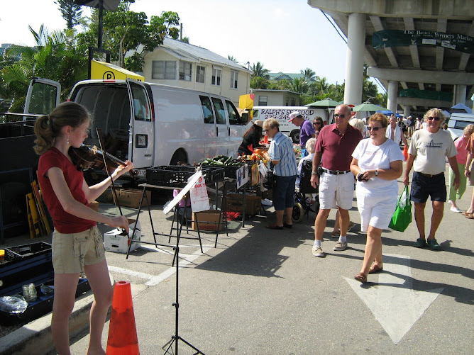 Rheannon busking at the Fort Myers farmers' market.